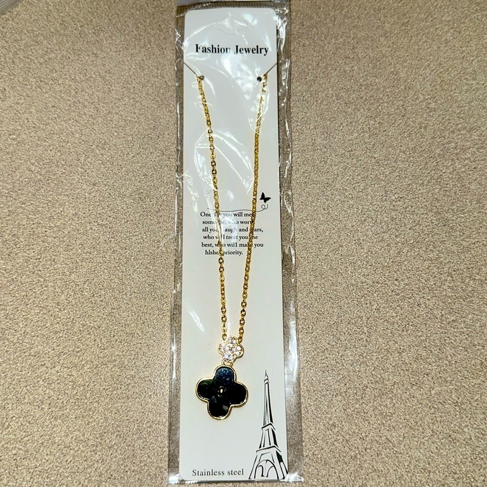 Black and crystal clover necklace